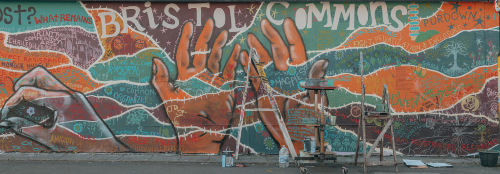 photo of mural with ladders in front